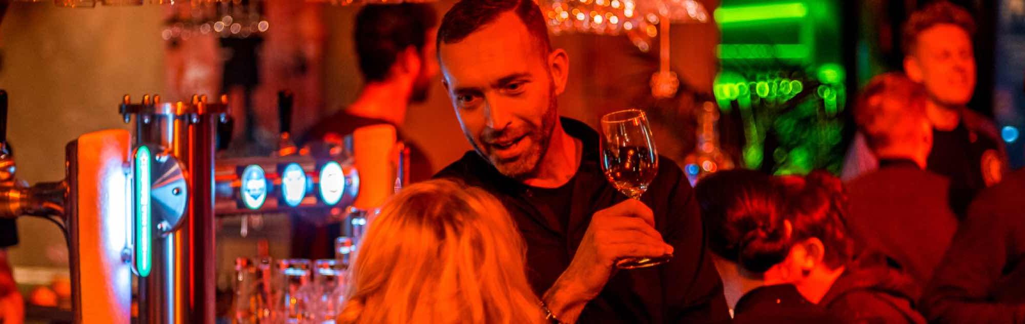 Men Talking To Women While Having Drink